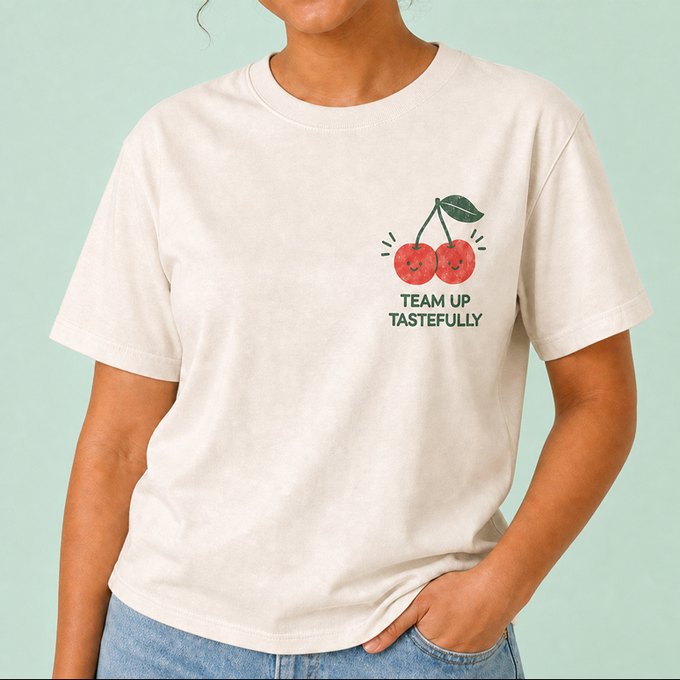 Cream tee with a small cherry pocket print